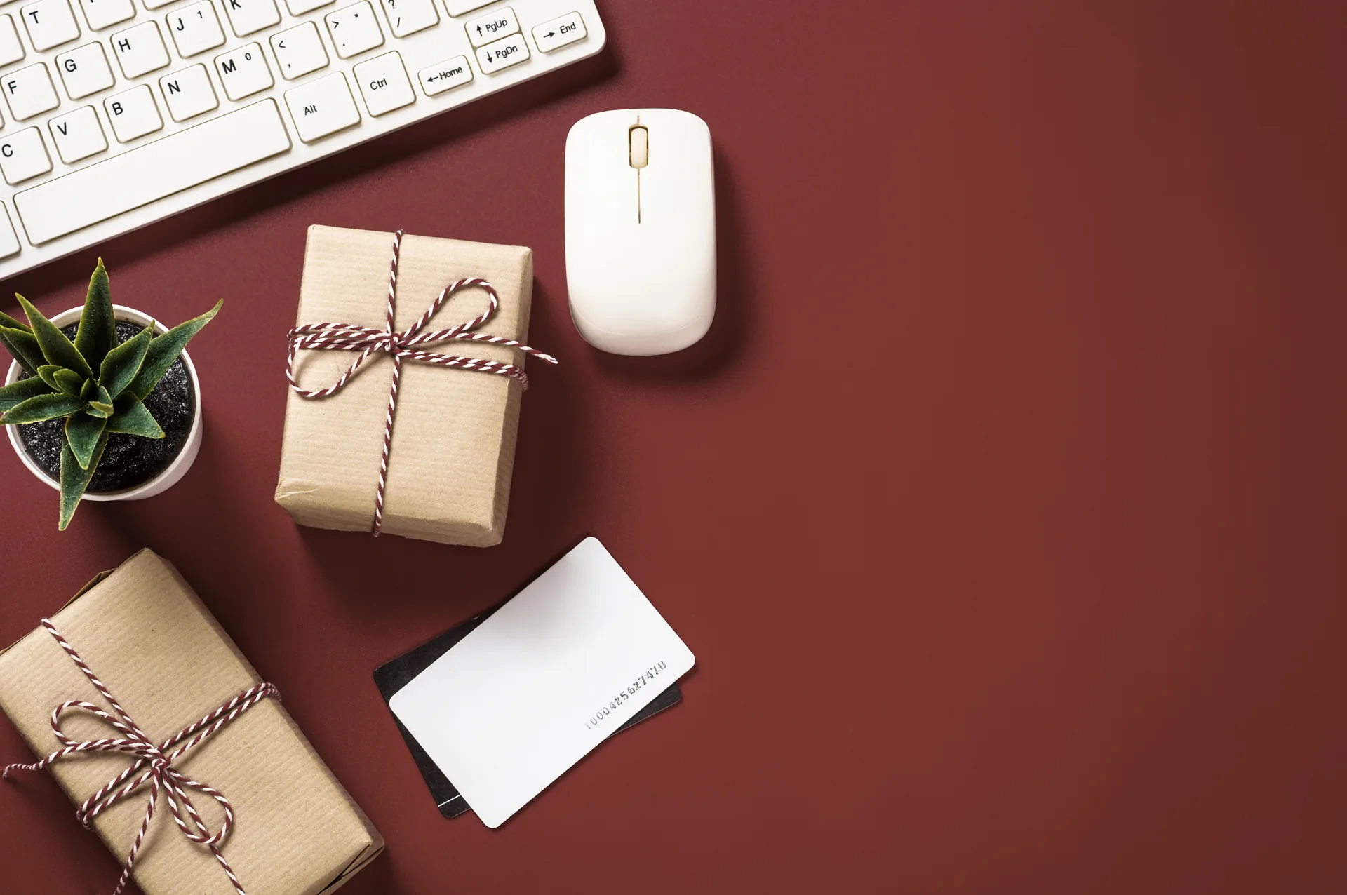 Hyde & Skyn corporate gifting set on a desk - maroon